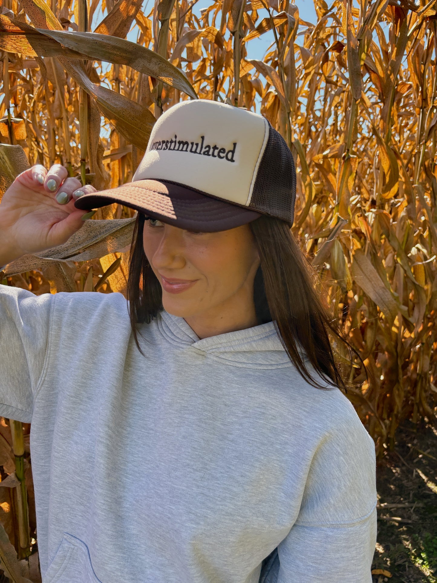“OVERSTIMULATED” EMBROIDERED TRUCKER HAT