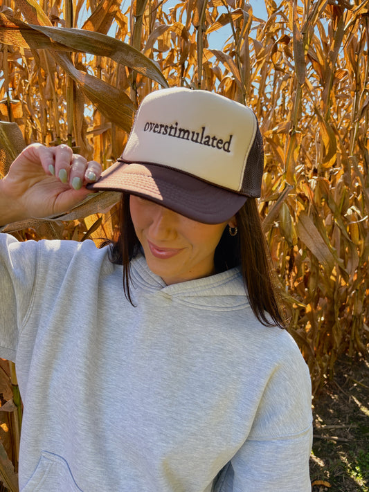 “OVERSTIMULATED” EMBROIDERED TRUCKER HAT